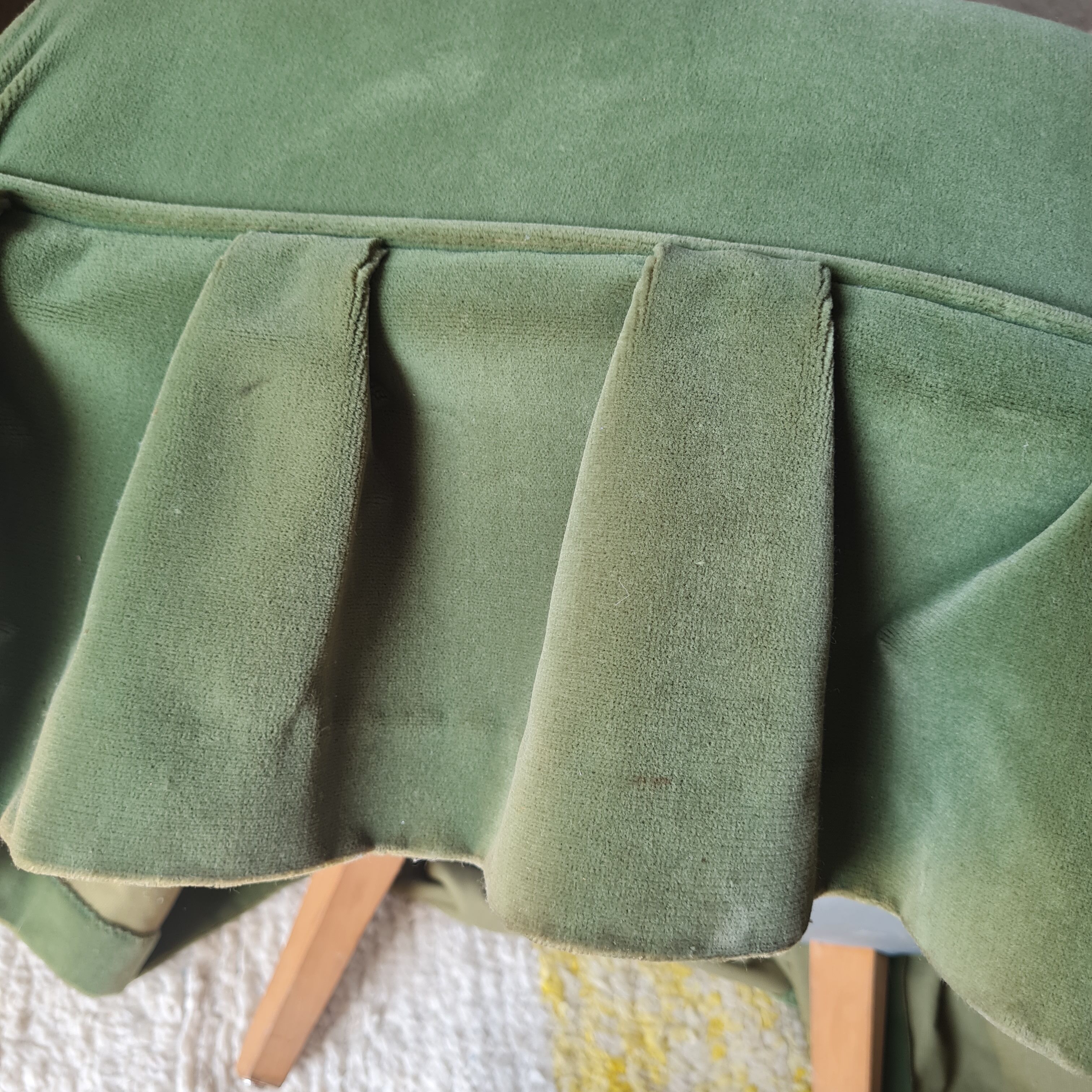 Green velvet armchair