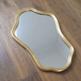 Golden mirror in wood and gold leaf