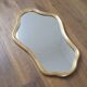 Golden mirror in wood and gold leaf