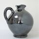 Black pearl glaze ceramic pitcher by Reinhold Rieckmann signed