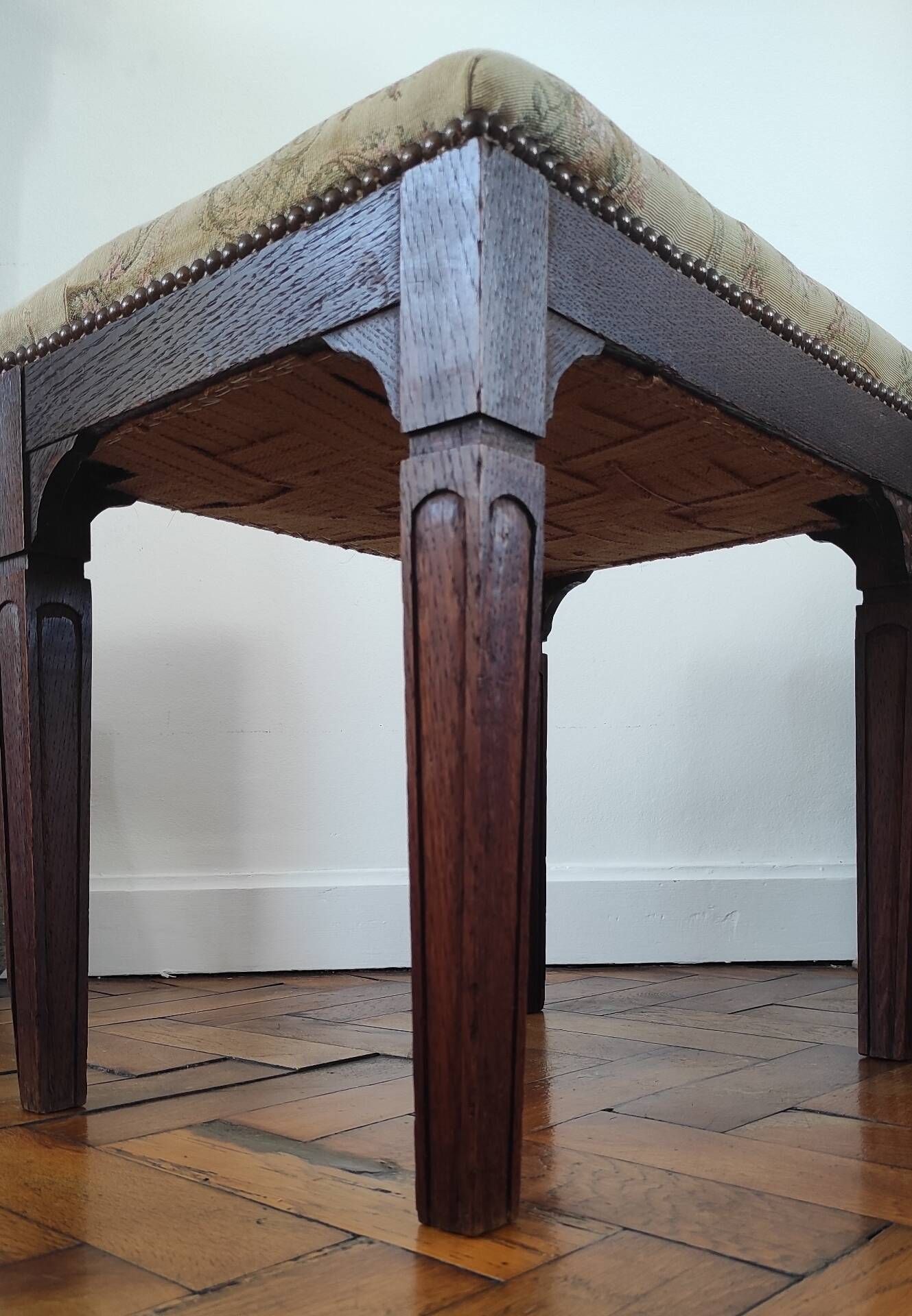 Footrest, vintage stool in solid oak with floral upholstery.