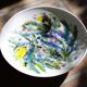 Decorated white earthenware fruit bowl