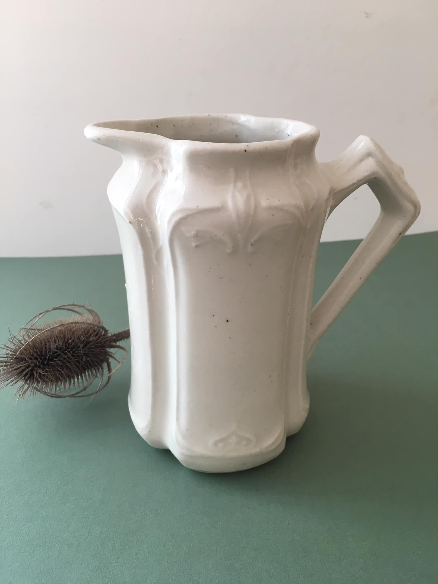 Antique ivory-coloured porcelain vase/pitcher