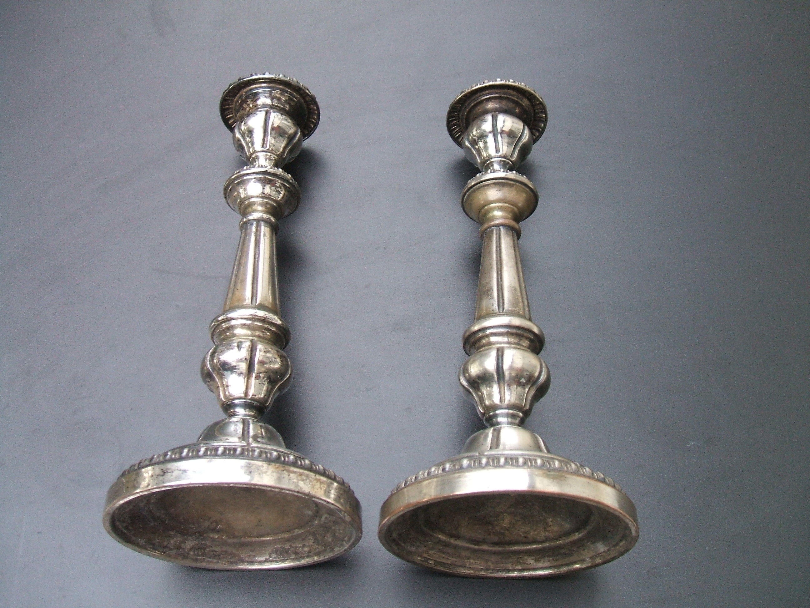 Pair of silver metal candle holders