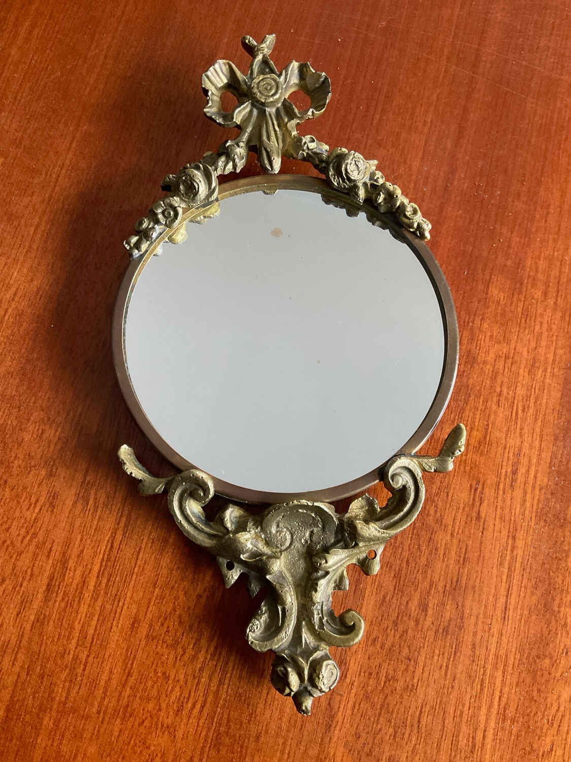 Antique small bronze mirror in Louis XIV style