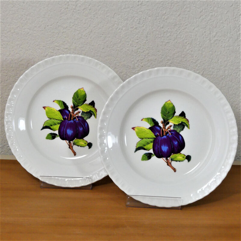 Eight antique dessert plates with multi-fruit patterns