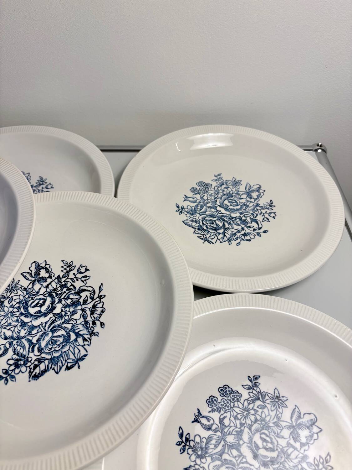 Set of 10 antique Lunéville flat plates – blue floral decoration