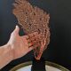 Large Red/Orange Gorgon Black wooden base. H: 36 cm