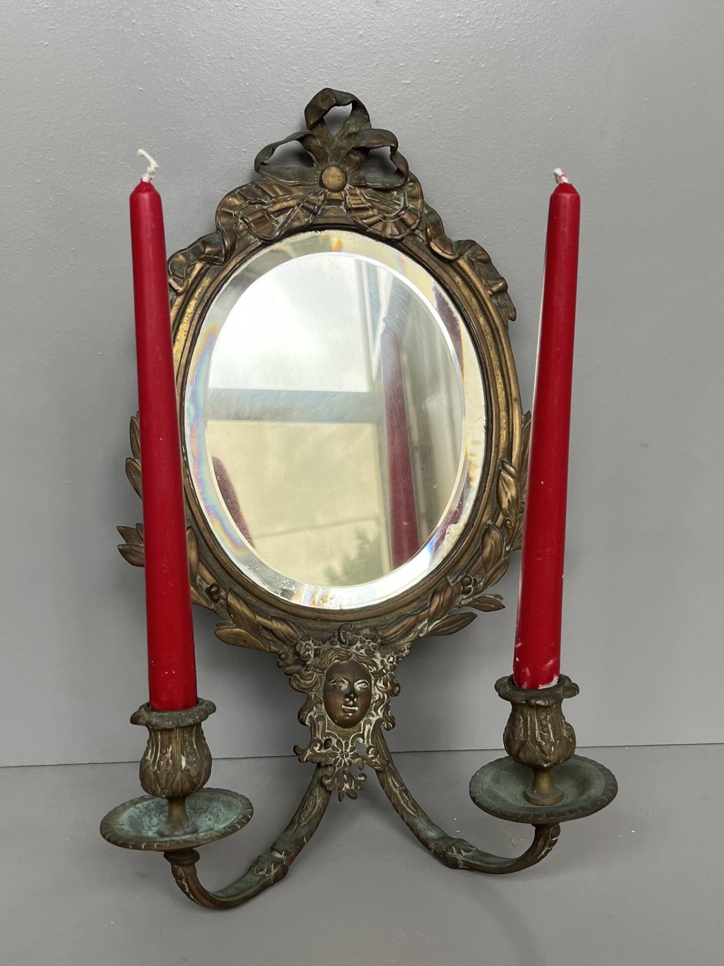 Pair of mirror sconces with bronze candlesticks from the 19th century.