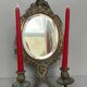 Pair of mirror sconces with bronze candlesticks from the 19th century.