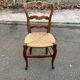 Louis XV 18th century solid wood dining chair with a straw seat.