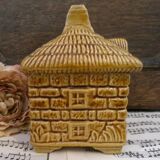 Devonway jam pot in the shape of a cottage with a thatched roof.