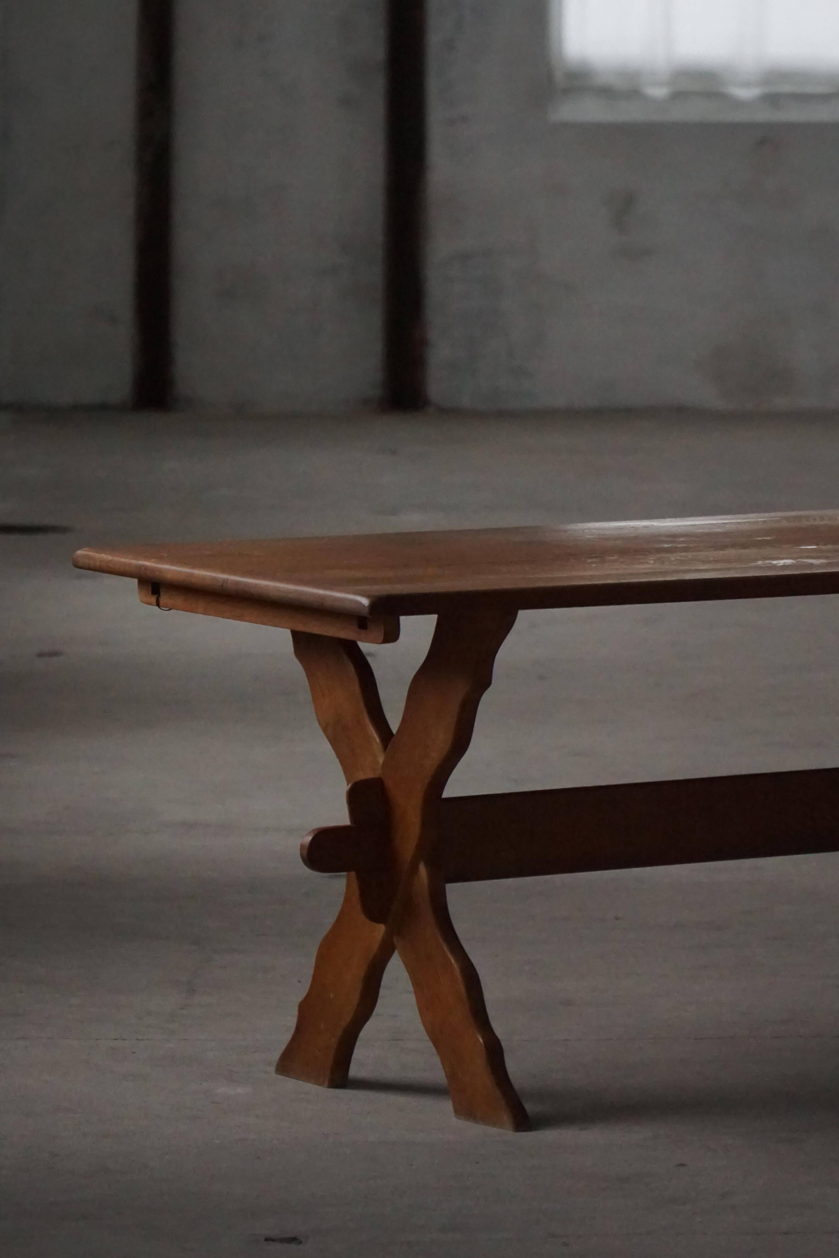 Solid oak dining table with cross base by Danish cabinetmaker, mid-20th century.
