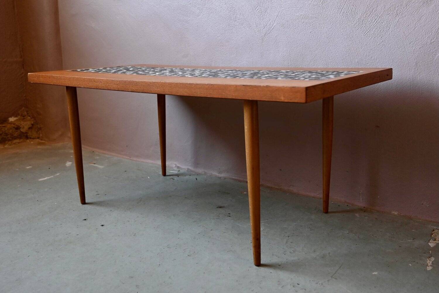 1970s coffee table with a tapered teak base and ceramic mosaic.