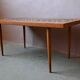 1970s coffee table with a tapered teak base and ceramic mosaic.
