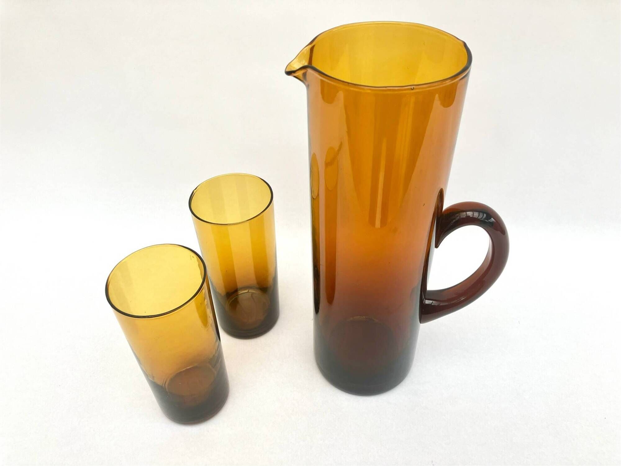 Carafe/pitcher and two amber glasses • Blown glass • France • 1970s