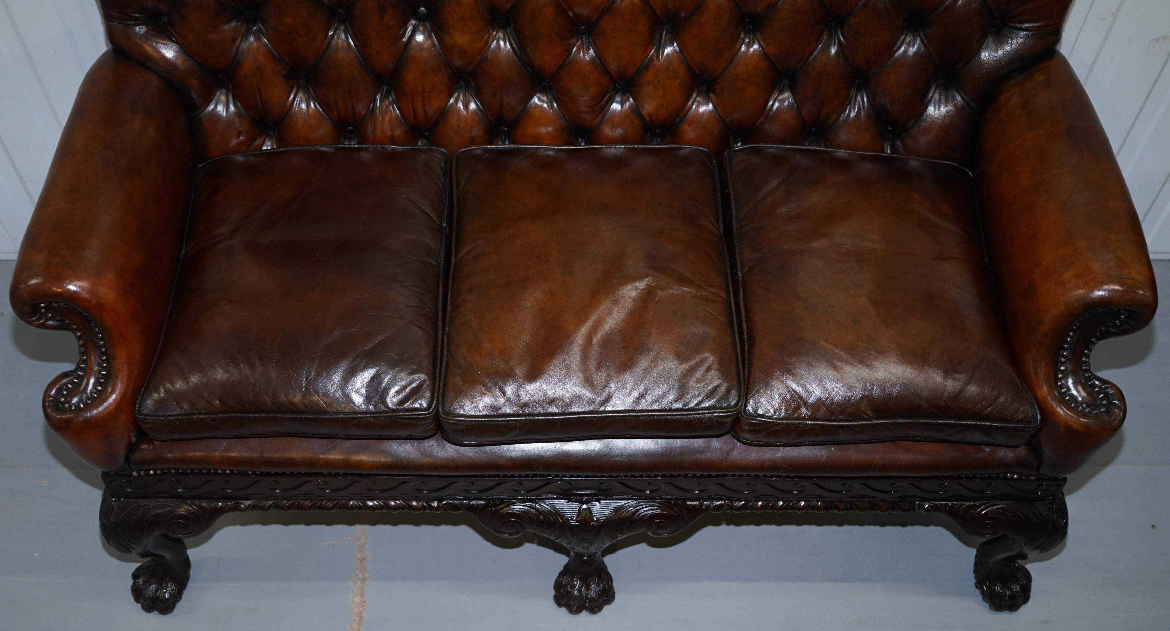 Chesterfield leather canapé in Georgian style with lion paw carved feet.