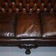 Chesterfield leather canapé in Georgian style with lion paw carved feet.