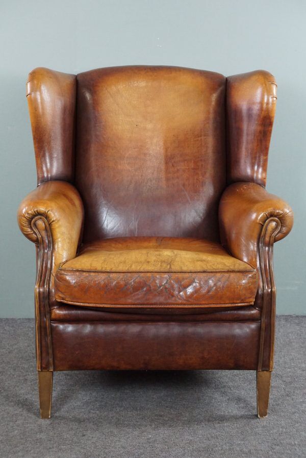 Armchair in patinated sheepskin leather