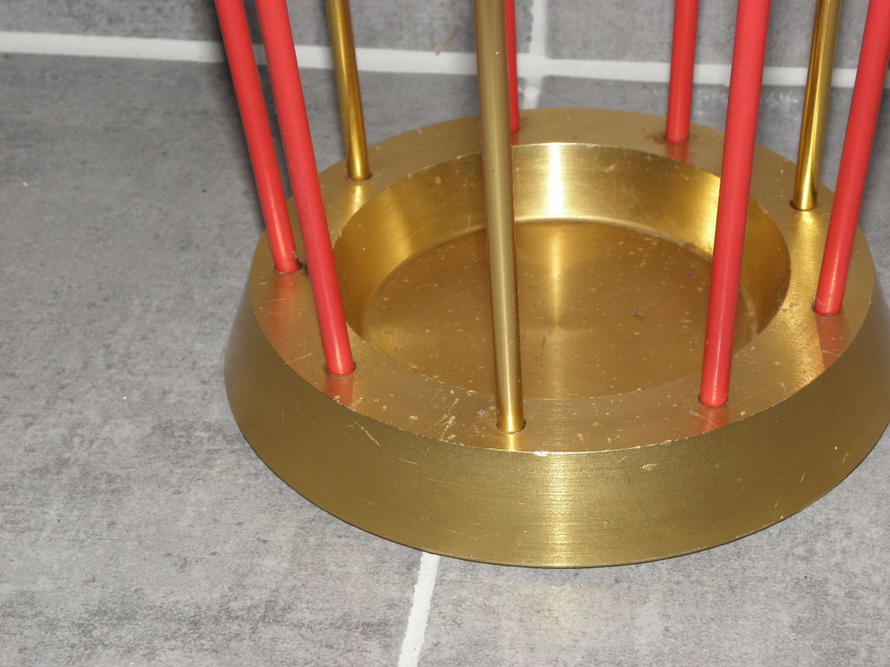 Golden and red umbrella holder