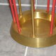 Golden and red umbrella holder