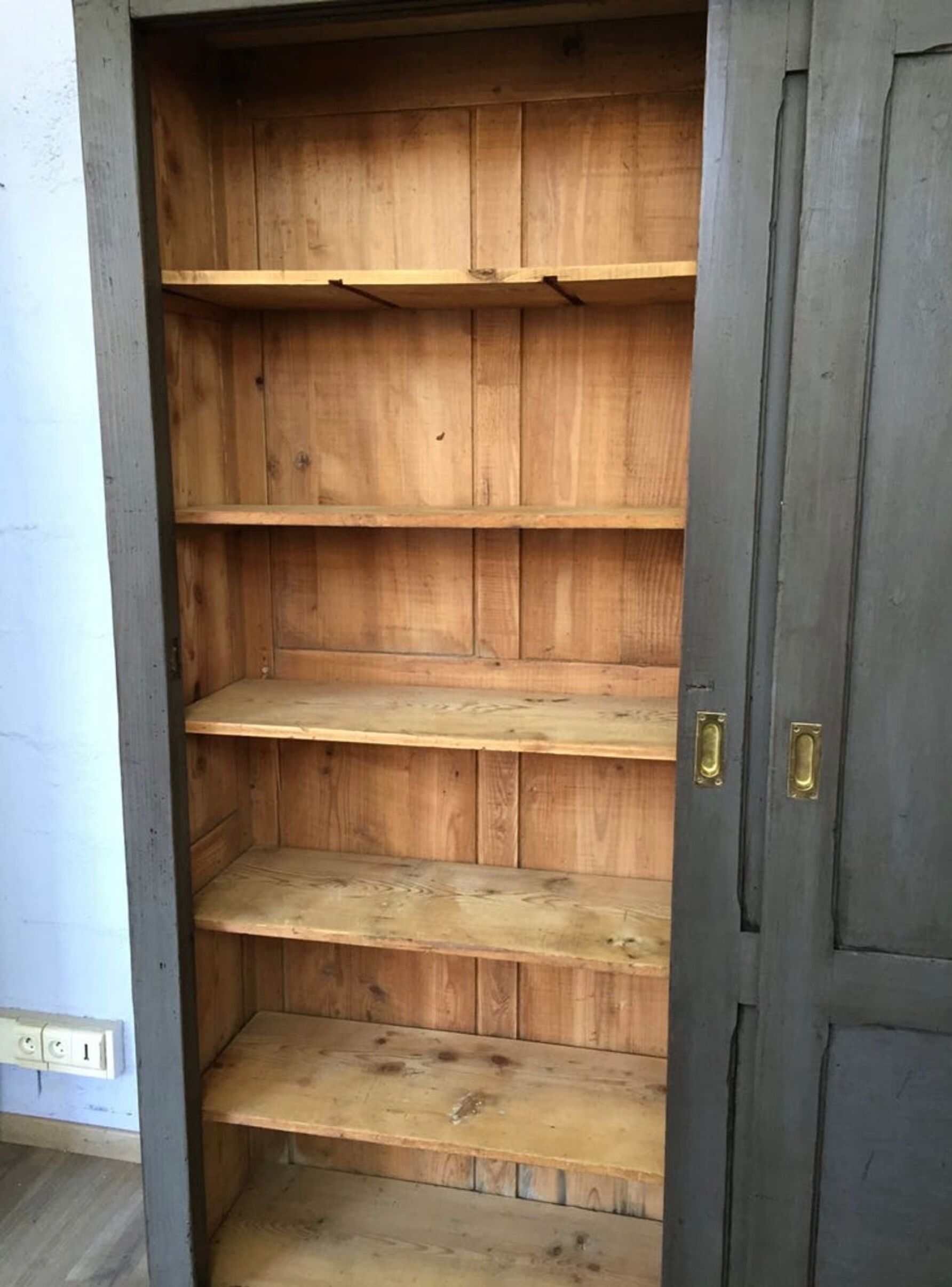 Old wooden cupboard massive sliding doors