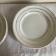 Set of 8 modernist flat plates in fine earthenware with pure gold trim, 1930.