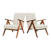 Pair of Mid-Century Modern armchairs in solid beech and boucle fabric.