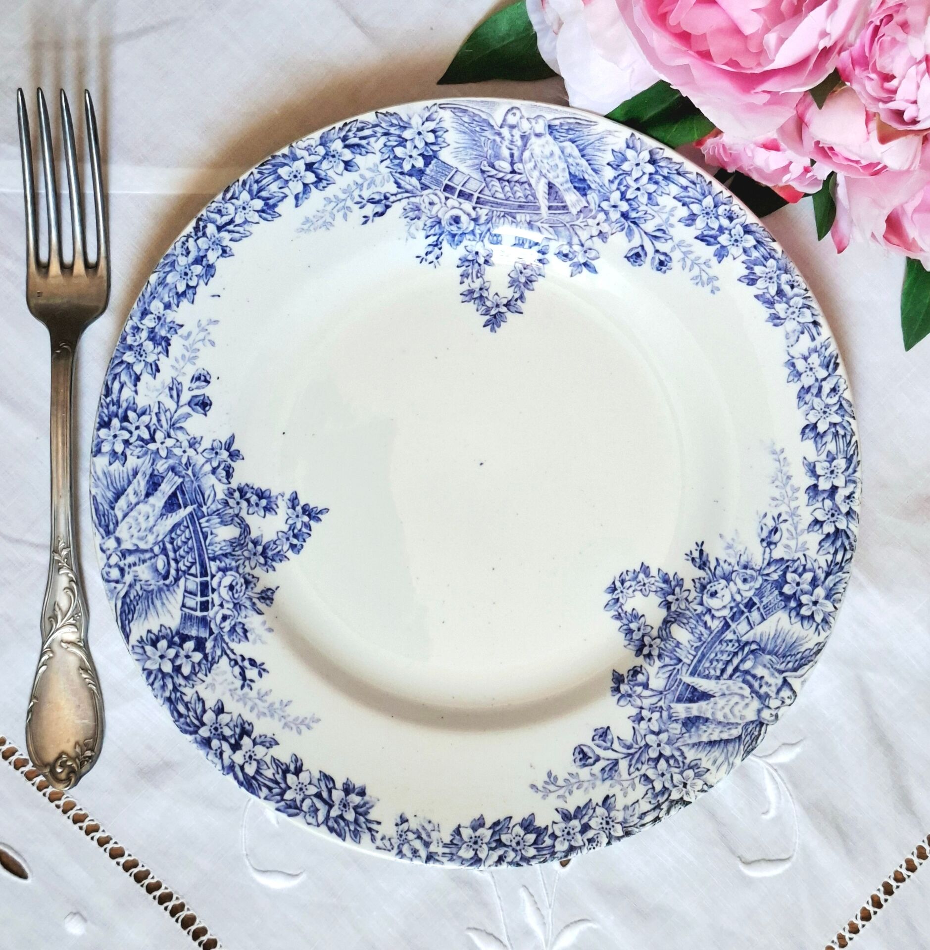Old mismatched flat plates made of ironstone earthenware.