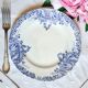 Old mismatched flat plates made of ironstone earthenware.