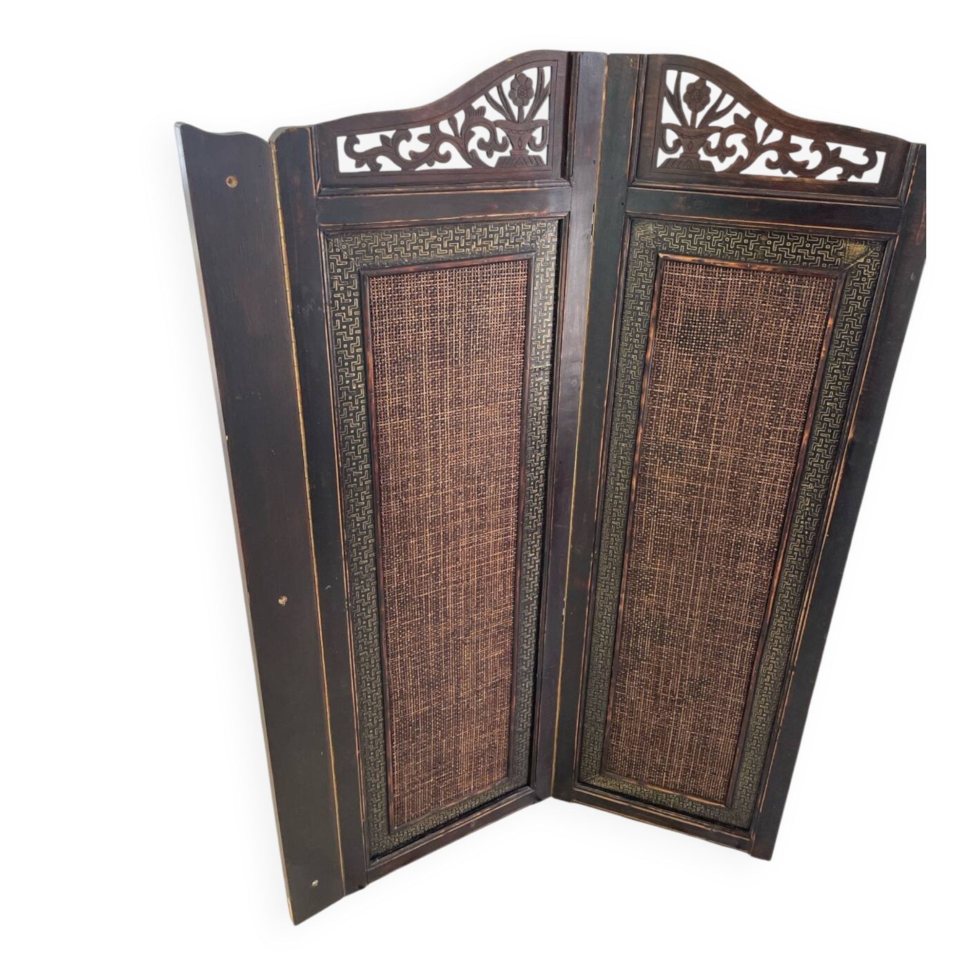 Antique wooden wall panel with carving and cane in an Asian style.