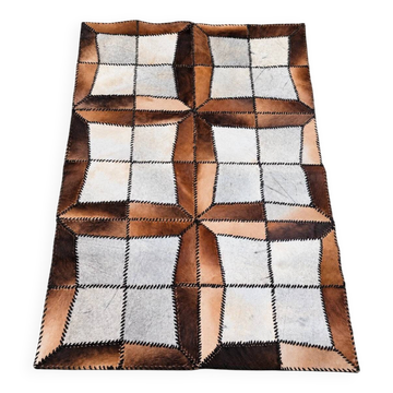 Tapis en patchwork de cuir de vache à lacets / années 1980