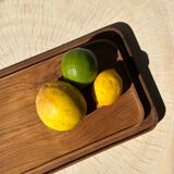 Trio of rounded rectangular trays or cups in monoxyl teak L:35