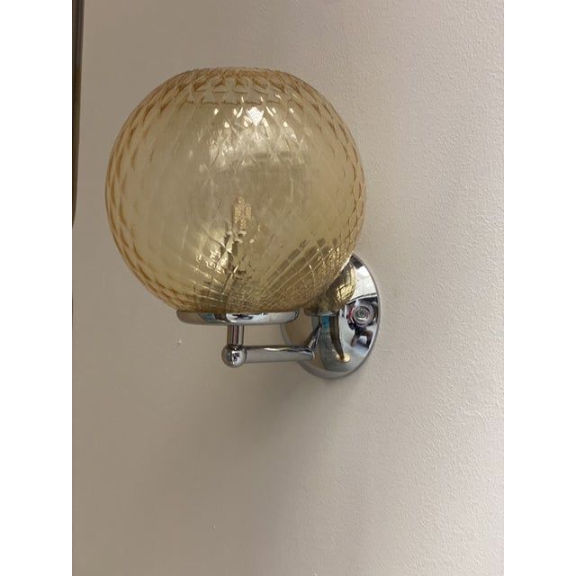 Contemporary "ballotton" amber murano glass wall sconce