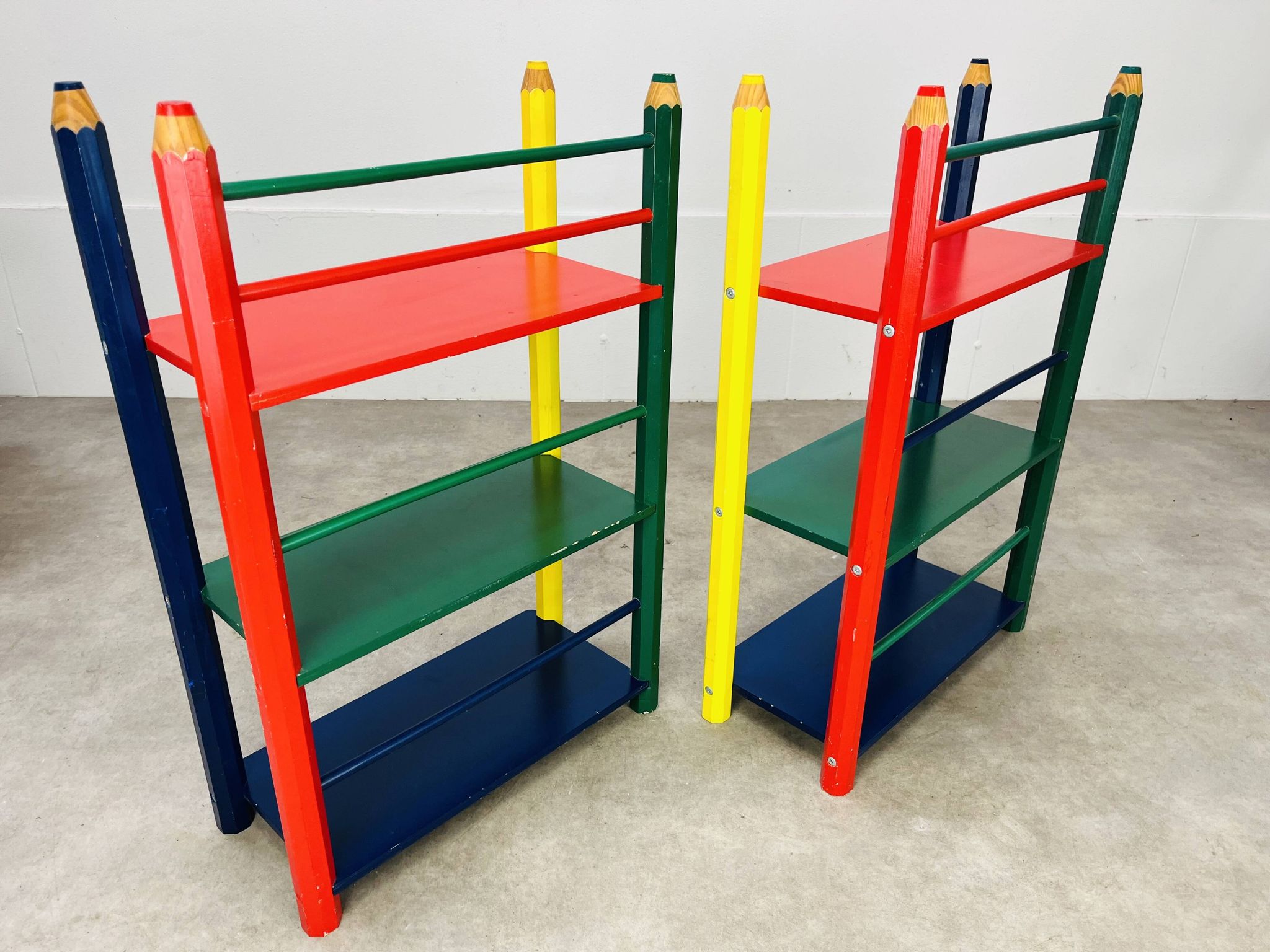Pair of pencil-style shelves by Pierre Sala for children.