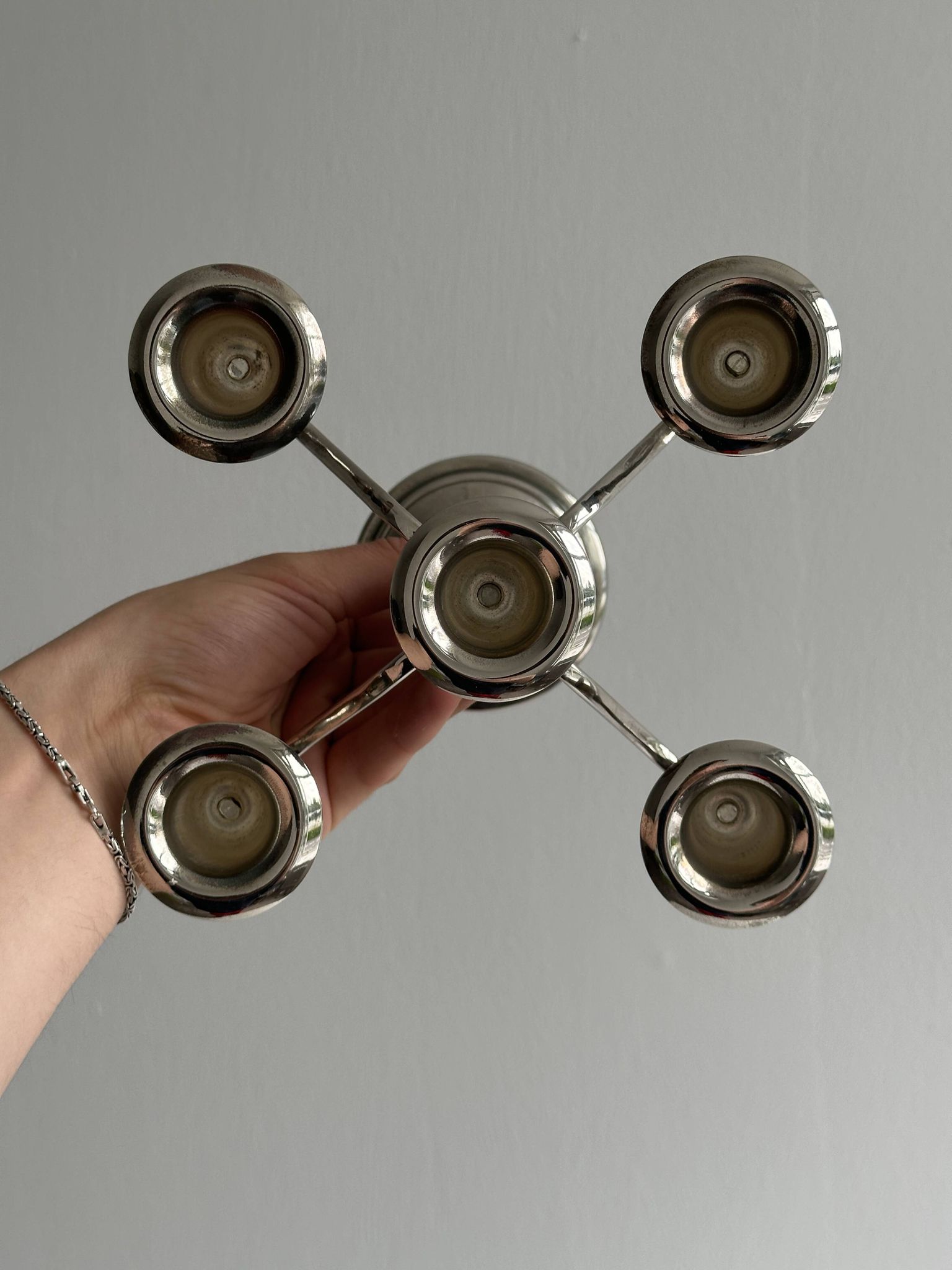 Candlestick candle holder in patinated silver metal