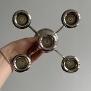 Candlestick candle holder in patinated silver metal