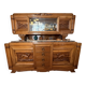 Solid wood sideboard with marble top and carved panels.