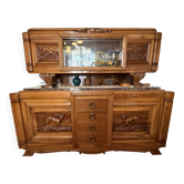 Solid wood sideboard with marble top and carved panels.