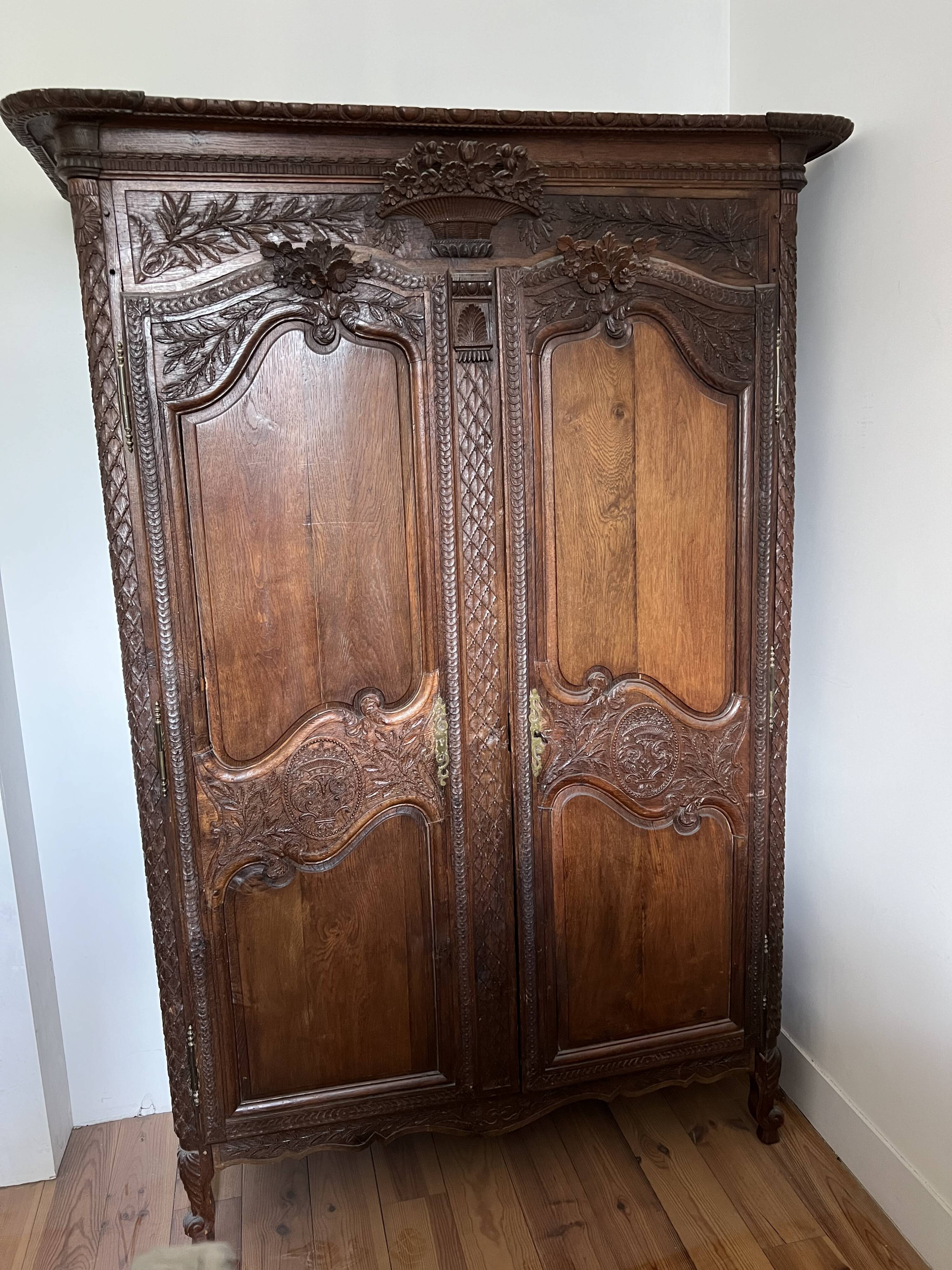Beautiful and ancient Norman wedding wardrobe, richly carved