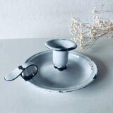 Old candle holder in white enameled metal
