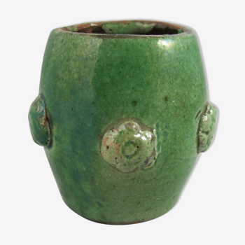 small green pot made of sandstone