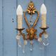 French antique Louis XV style twin arm wall sconces in bronze with crystals.