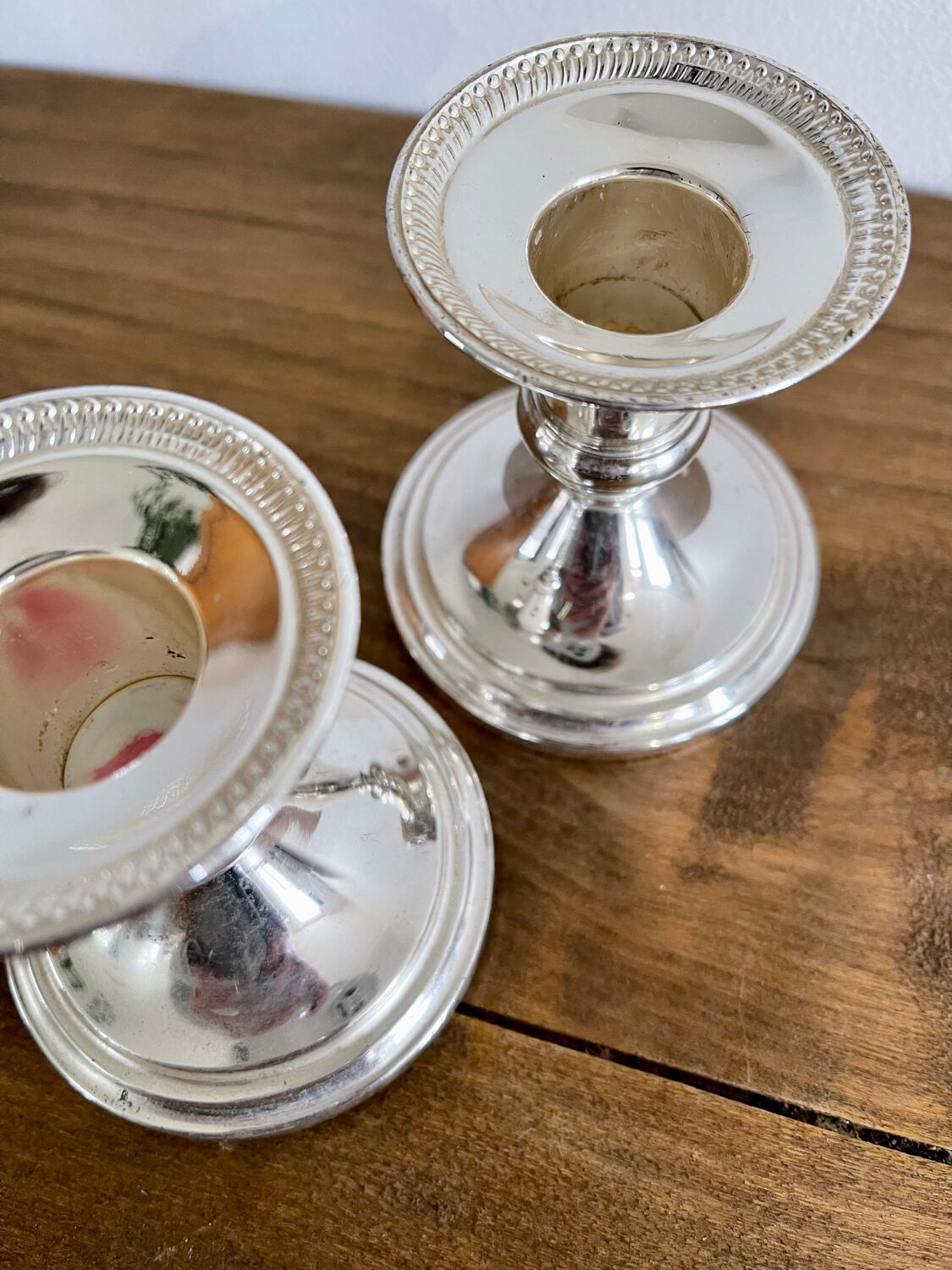 Pair of silver metal candle holders