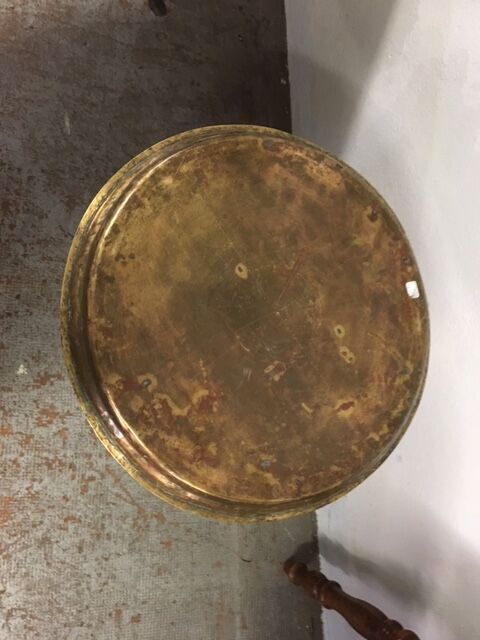 Old foot cast-iron bistro and brass round tray