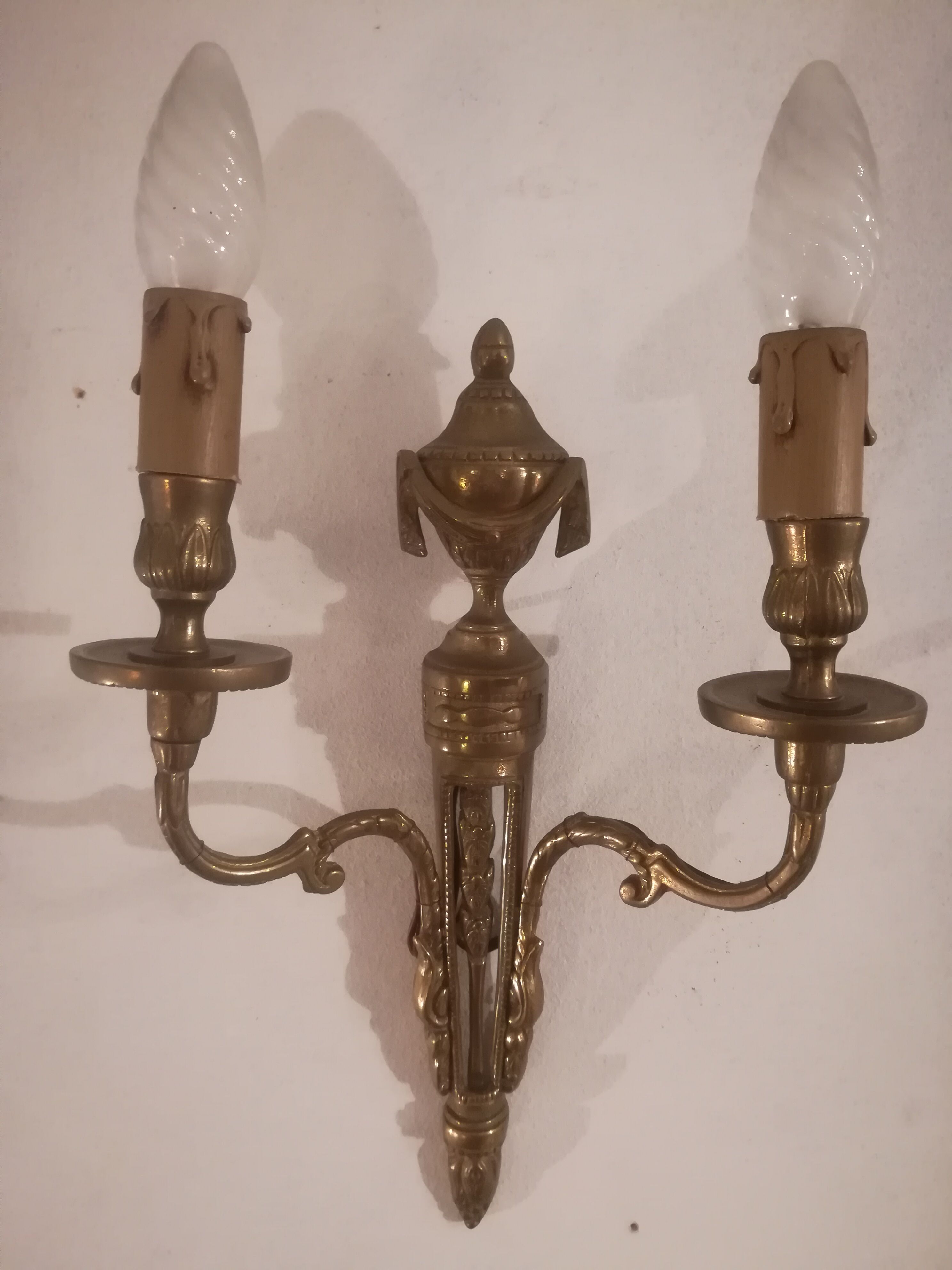 Pair of Louis XVI style sconces in gilded bronze