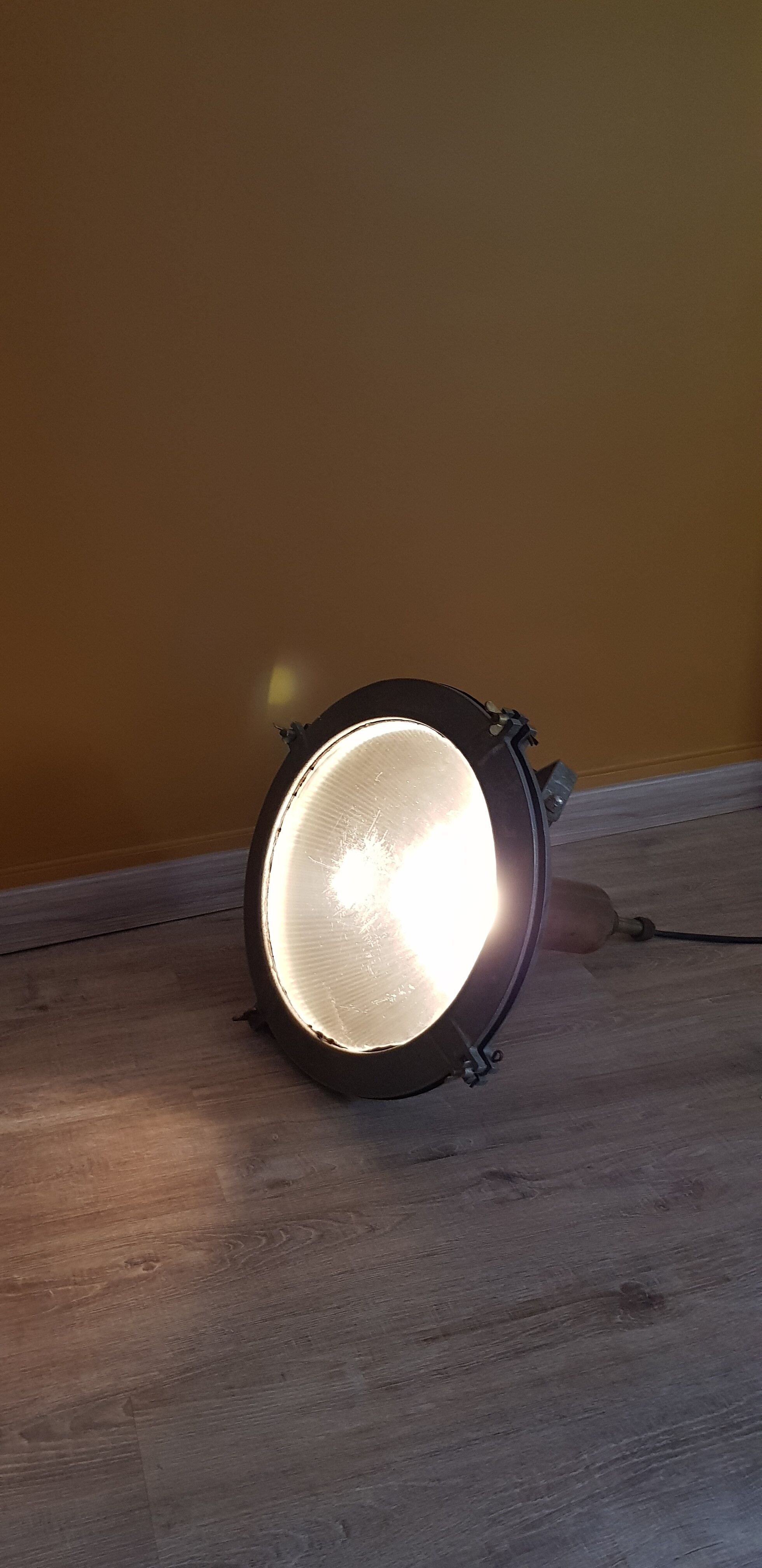 Old brass boat headlight with Holophane interior glass