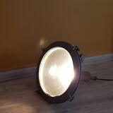 Old brass boat headlight with Holophane interior glass