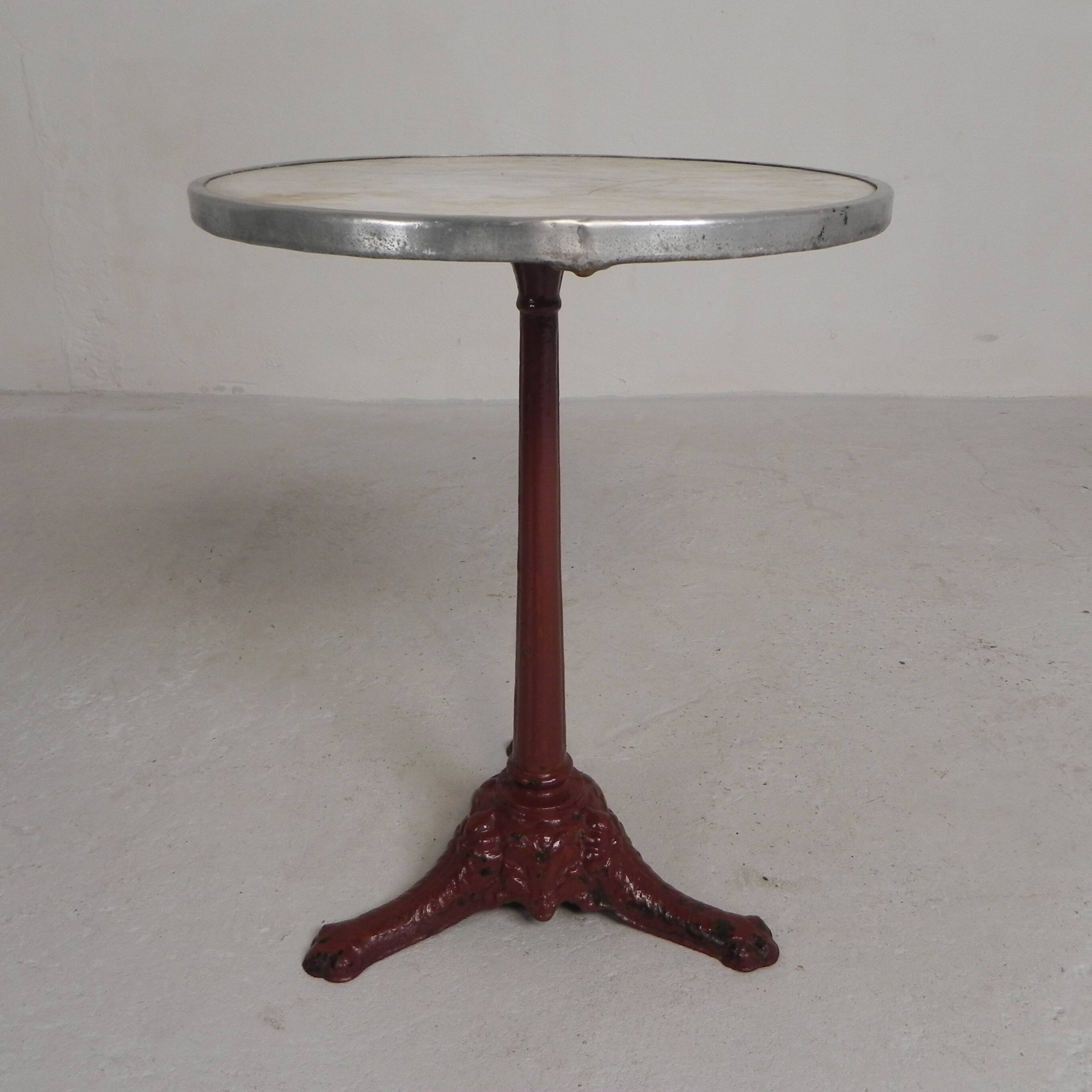 Bistro table with cast iron legs and marble top, 1920s.