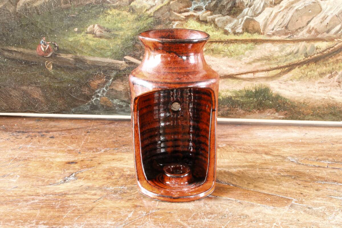 Signed orange ceramic candle holder and jug